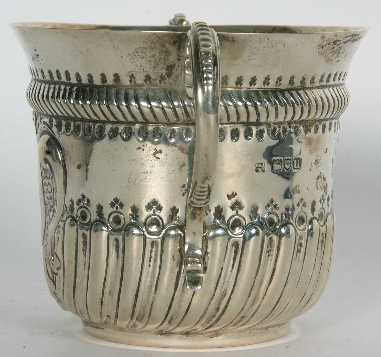 An early 20th Century copy of a George I loving cup, having two beaded scrolled handles, wrythen - Image 31 of 36