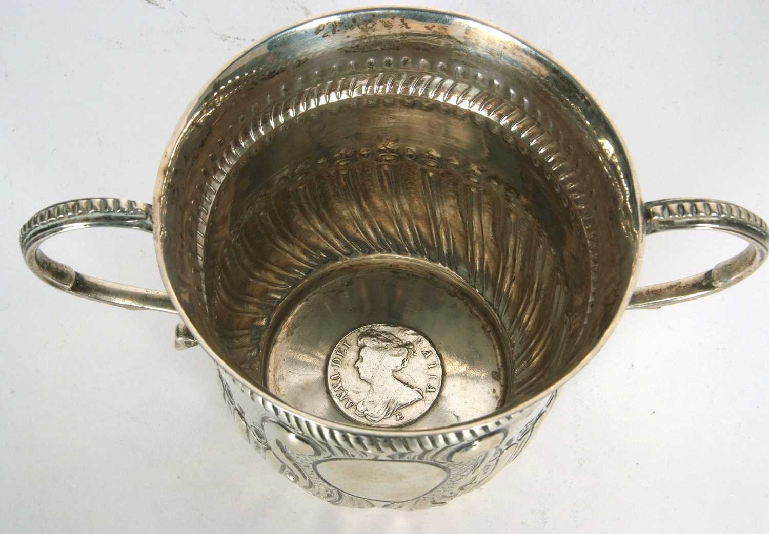 An early 20th Century copy of a George I loving cup, having two beaded scrolled handles, wrythen - Image 17 of 36