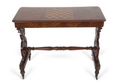 A Victorian walnut veneered and inlaid table, the centre of the top with a chess board decoration,