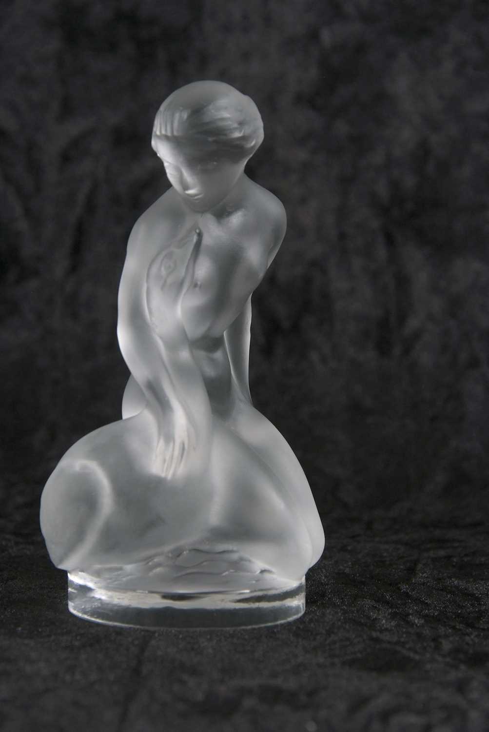 Lalique model of Leda and a swan in clear and frosted glass with etched mark to base, 11cm high