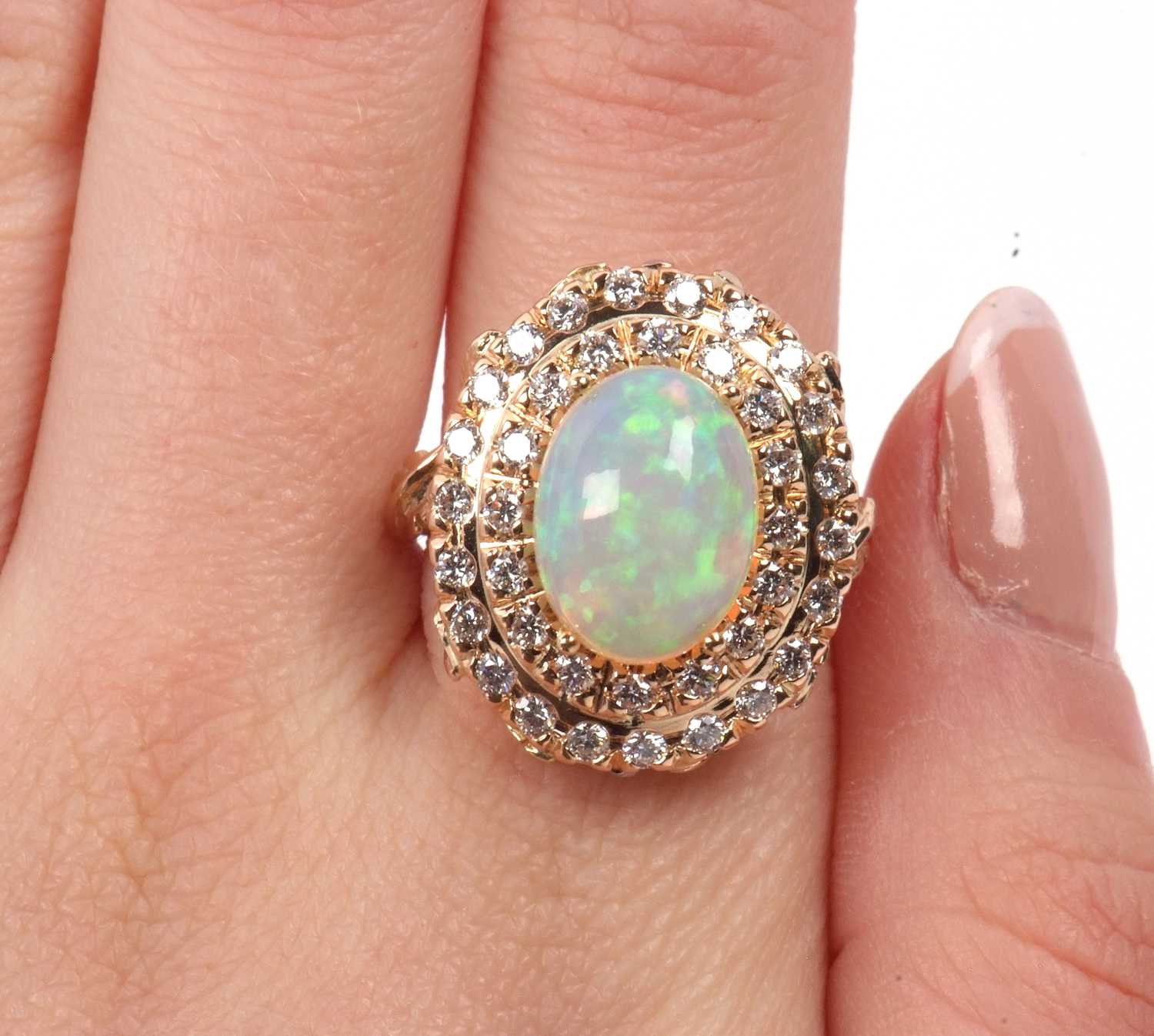 18ct opal and diamond ring, the central oval opal cabochon, approx. 13.1 x 9.8 x 6.1mm, surrounded - Image 9 of 9