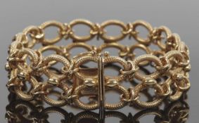 Fancy link bracelet, comprosed of two rows of hollow oval textured links with stud and hoop joins,