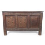 18th Century oak coffer, solid board lid over a front with three panels with inlaid decoration