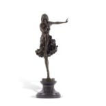 After Demetre Chiparus hollow bronze model of an Art Deco dancer raised on a polished stone base,