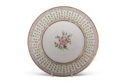A Swansea plate decorated with a floral design to the centre within a gilt and floral border