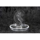 Lalique pin dish, the centre with a model of an Art Nouveau lady with etched mark to base, 11cm