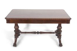 A 19th Century rosewood two drawer table, a rectangular top over two tapering columns with