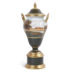 Wedgwood porcelain vase and cover with gilt handles on circular stand, the body finely painted