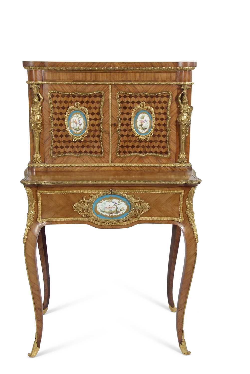 A French walnut porcelain and ormolu desk with two panelled doors to the top over a base with single