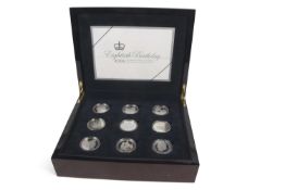 A cased set of silver proof coins made to commemorate the 80th Birthday of Queen Elizabeth II 2006