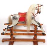 G & J Lines- A fine early 20th century dappled grey rocking horse with metal rocker and later