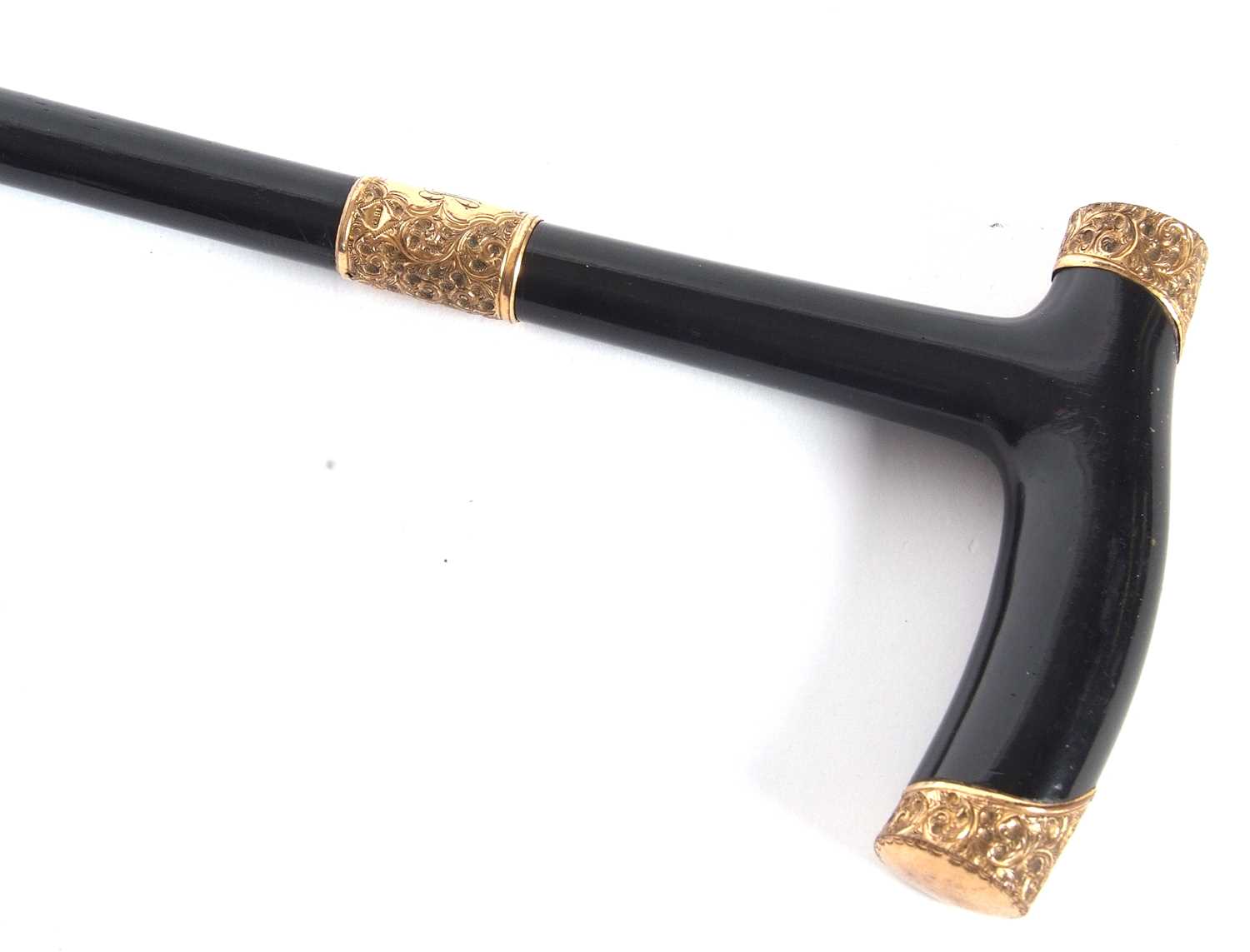 A late 19th Century ebonised walking cane/stick with foliate engraved 18ct gold mounts (each mount - Image 3 of 8