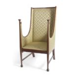 A late 19th or early 20th Century mahogany framed armchair with Arts & Crafts influence style with