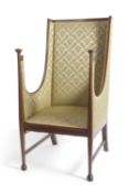 A late 19th or early 20th Century mahogany framed armchair with Arts & Crafts influence style with