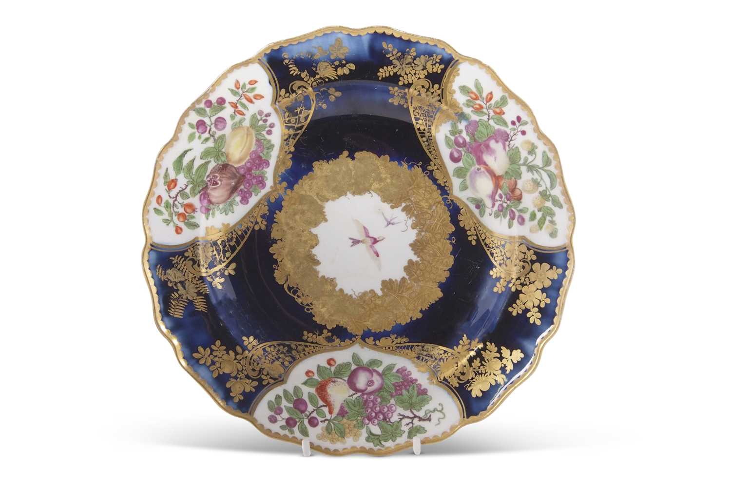 A Chelsea Gold anchor plate the mazarine ground with panels of painted fruit within gilt borders,