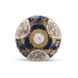 A Chelsea Gold anchor plate the mazarine ground with panels of painted fruit within gilt borders,