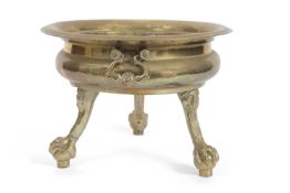 A large 19th Century brass jardiniere or wine cooler of circular form with large looped handles