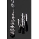 18ct white gold black and white diamond ring and pendant necklace, the ring comprised of a triple