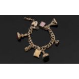 9ct curblink charm bracelet, set with variously marked and unmarked charms to include a sunstone