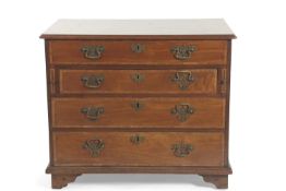 A George III mahogany and cross banded secretaire chest of four drawers, raised on bracket feet,
