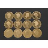 A box set of 12 gold plated (on silver) coins "The Golden History of Powered Flight", each coin 36mm