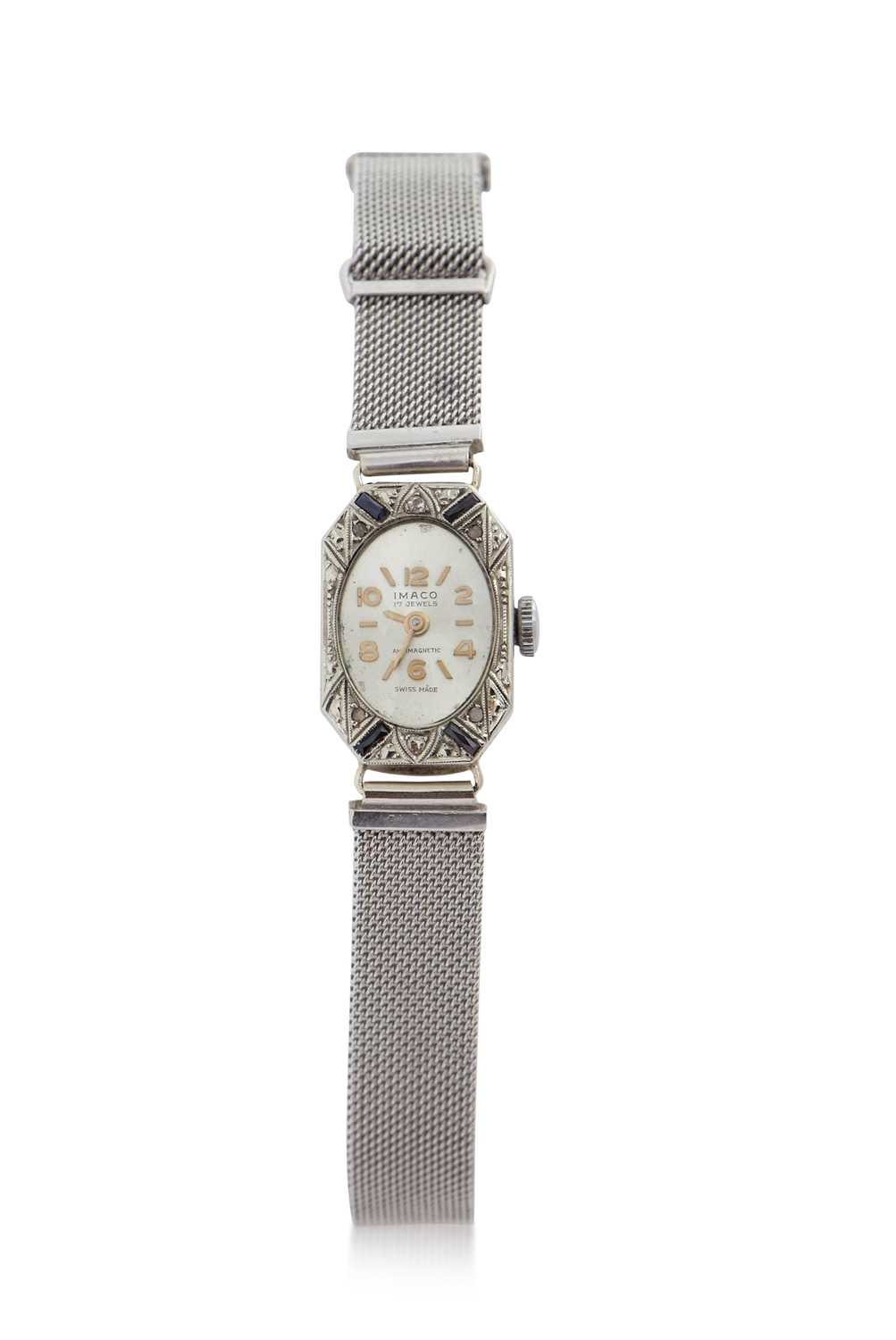 A white metal and diamond set Imaco ladies cocktail watch stamped 18k on the case back, the watch is