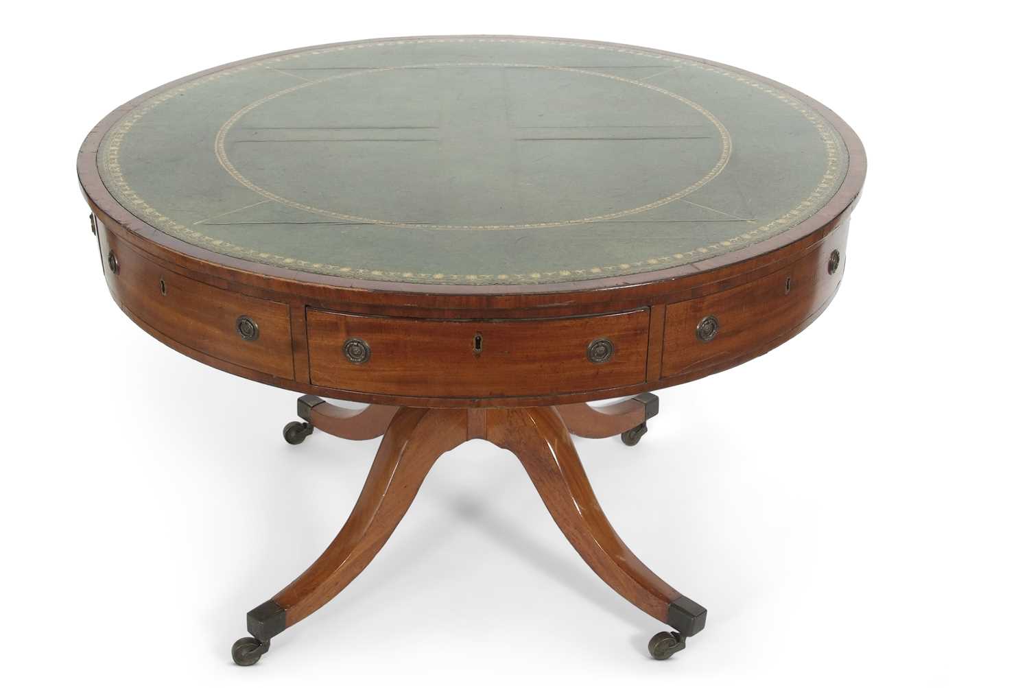A George III mahogany drum table of typical form, the top inset with green tooled leather and fitted