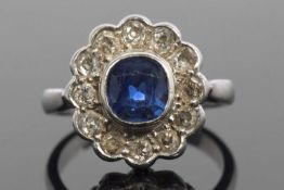 Sapphire and diamond cluster ring, the cushion shaped faceted sapphire is 7x7x4mm approx, bezel