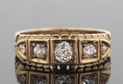 Victorian five stone diamond ring featuring five graduated old brilliant cut diamonds each in a