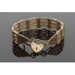 9ct fancy link bracelet, stamped 375, with heart shaped clasp, 36.9gms