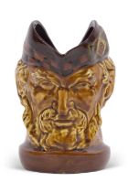 A rare Royal Doulton Kings ware McCallum character jug in a treacle glaze