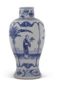 A Chinese porcelain baluster shape vase decorated in blue and white with Chinese figures in Kangxi