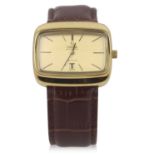 An Omega De Ville automatic gents watch, the watch has a gold plated case with matching gold