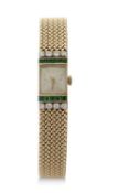 Ladies yellow metal cocktail watch with ten calibre emeralds pave set and eight round brilliant