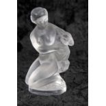 Lalique frosted glass model of a lady with goat, kneeling on rocky mound, on circular base with