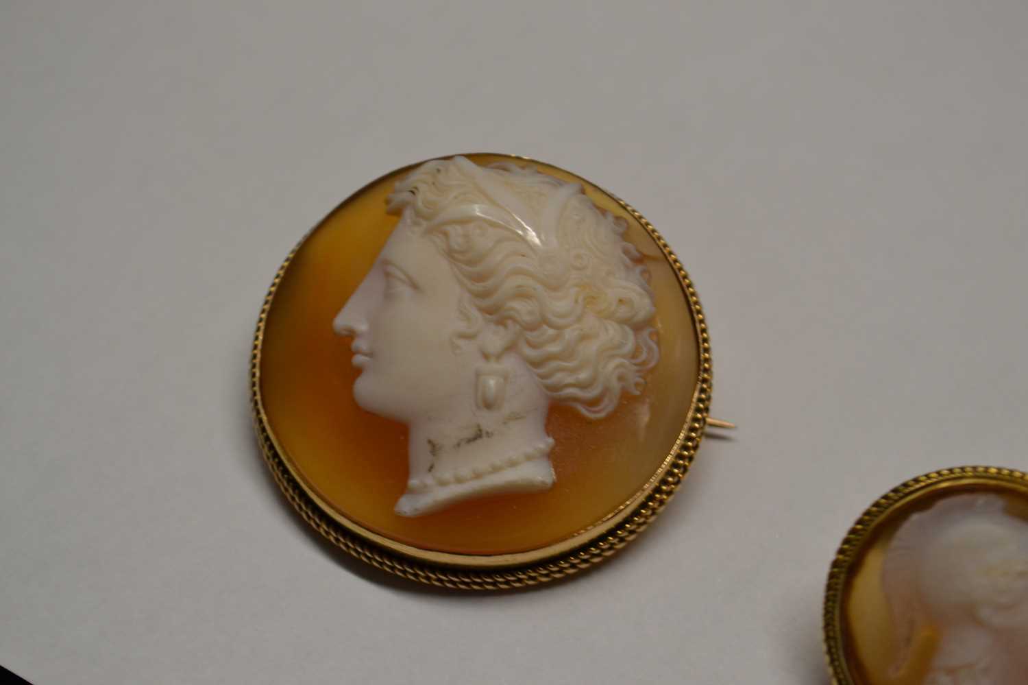 A hardstone carved cameo and earrings, the round hardstone cameo of a lady, with delicately curled - Image 8 of 10