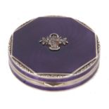 A white metal and enamel compact of octagonal form, the lid decorated with a purple guilloche enamel