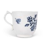 A Lowestoft porcelain cup decorated with trailing flowers and butterfly circa 1765, numeral No 8