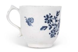 A Lowestoft porcelain cup decorated with trailing flowers and butterfly circa 1765, numeral No 8