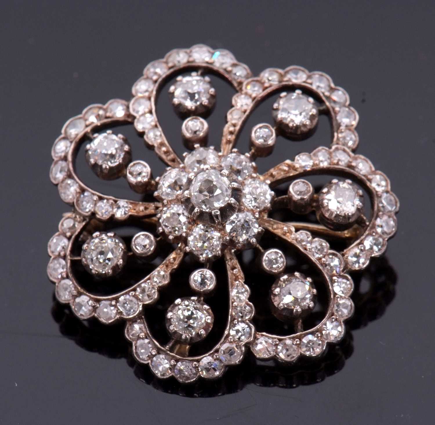 A late 19th/early 20th century diamond brooch, the central diamond flowerhead cluster, surrounded by - Image 7 of 8