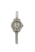 A precious metal ladies wristwatch on a 9ct white gold bracelet, with a diamond bezel surround,