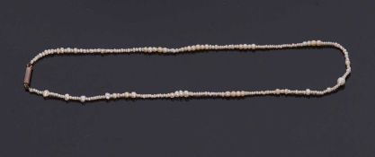 A seed pearl choker, the seed pearls of varying sizes with later barrel clasp, 33cm long, with