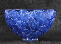A Studio Glass bowl of blue colour with a design of leaping fish with engraved signature for Julia