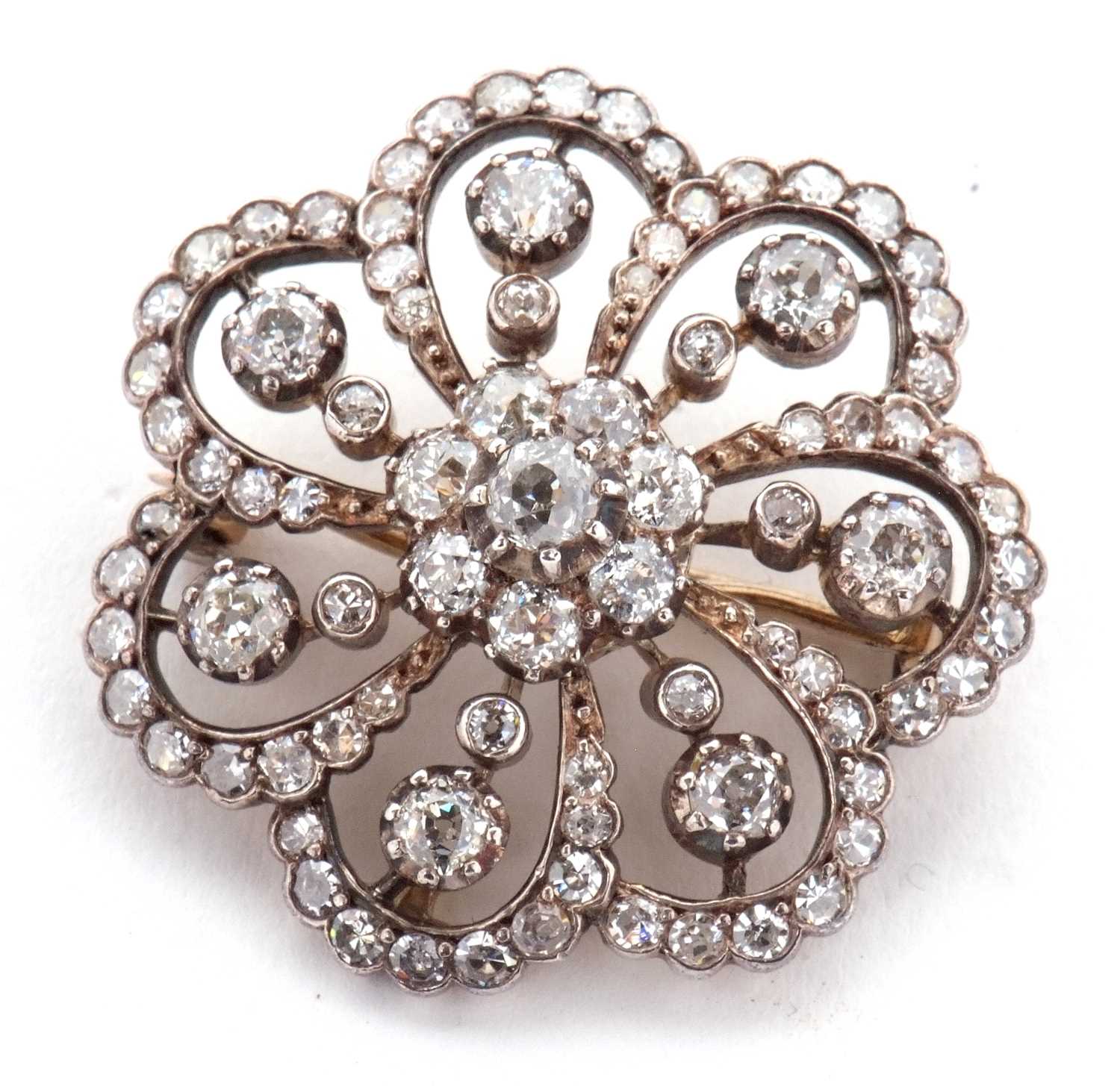 A late 19th/early 20th century diamond brooch, the central diamond flowerhead cluster, surrounded by - Image 4 of 8