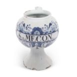 A Delft drug jar probably London circa 1740 of globular form on spreading foot decorated in blue