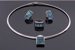 An 18ct white gold and topaz suite after H.Stern, the necklace with bowed pendant set with