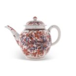 A Lowestoft porcelain teapot circa 1780, underglaze blue decoration with overglaze iron red floral