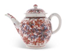 A Lowestoft porcelain teapot circa 1780, underglaze blue decoration with overglaze iron red floral
