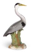 A large Meissen porcelain model of a heron, seated or standing on a naturalistically modelled lily