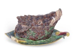 An extremely rare and important Minton Maiolica game tureen and stand, the cover modelled as a boars